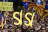 Pro-independence Catalans, members of Omnium Cultural and National Assembly of Catalonia -ACN- demonstrate in support of the independence referendum planned for November 9 at Catalunya square in Barcelona, on October 19, 2014. Opposition parties in Catalonia on October 15 demanded a snap regional election after pressure from Madrid forced leaders to water down plans for a vote on independence from Spain. Letters read "Yes-Yes."  