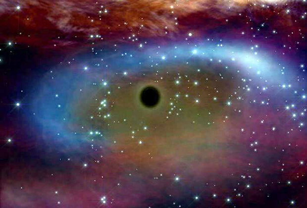 Сверхмассивная чёрная дыра потребляет материю вращающейся вокруг нее звезды (в представлении художника)