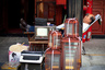 An antique shop owner naps on a chair outside his shop at a market in Beijing, China, Monday, Aug. 23, 2010. (AP Photo/Alexander F. Yuan)