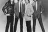 Ирландская хард-рок группа Thin Lizzy — будто пришельцы из прошлого. Брюки-дудочки, узкие галстуки и длинные волосы — в 1980-м году, когда сделана эта фотография, все это уже не было мейнстримом. 