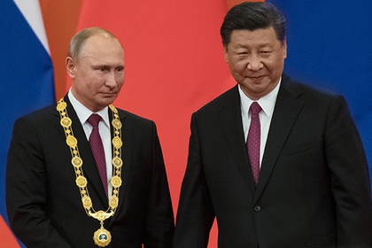 Путина первым удостоили высшей награды Китая