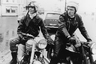 Фильм «Кожаные парни» (The Leather boys) — британская драма 1964 года, один из первых английских фильмов, снятых по голливудским лекалам. Его герои — настоящие иконы стиля рокеров начала 1960-х: шелковые шарфы, подвернутые джинсы, кожаные куртки, сапоги и перчатки.