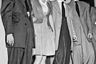 Молодые люди на танцах в одном из отелей Вашингтона, округ Колумбия. В отличие от парней, одетых в зуты, девушки правила не нарушают — у них короткие юбки, на которые ушло не так и много материи. Август 1942 года. 
