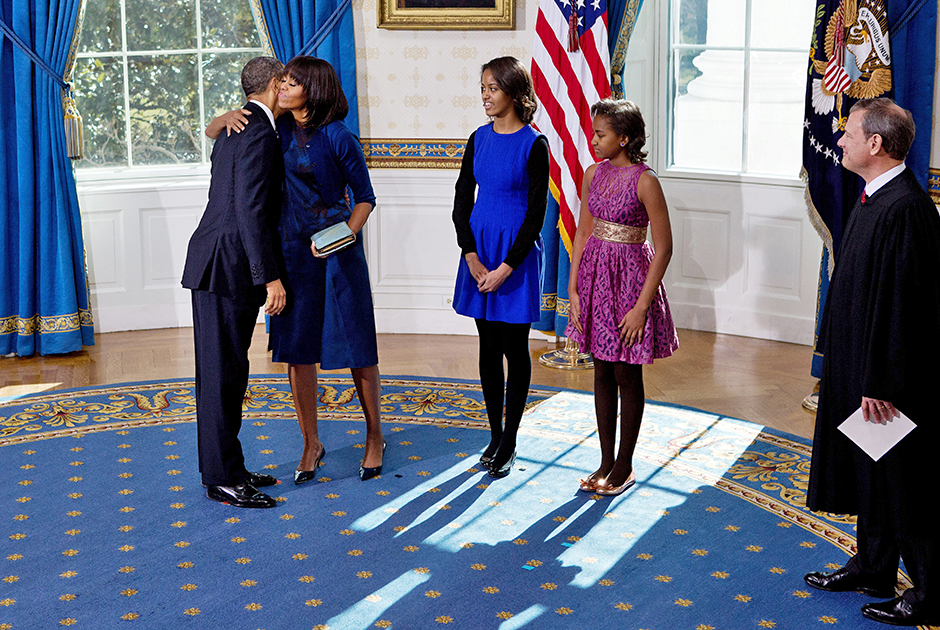 Obama Sworn In During Official Ceremony

WASHINGTON - JANUARY 20: U.S President Barack Obama (L) hugs the first lady Michelle Obama (2nd L) as daughters Malia (3rd L) and Sasha(2nd R) and U.S. Supreme Court Chief Justice John Roberts look on after taking the oath of office in the Blue Room of the White House January 20, 2013 in Washington, DC. Obama and U.S. Vice President Joe Biden were officially sworn in a day before the ceremonial inaugural swearing-in. (Photo by Doug Mills-Pool/Getty Images)