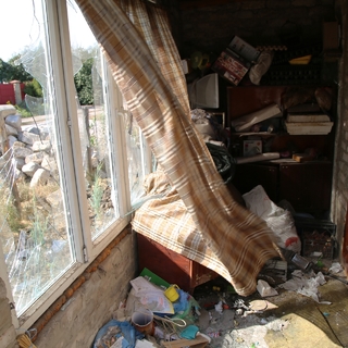 Окна жилого дома в поселке Старомихайловка