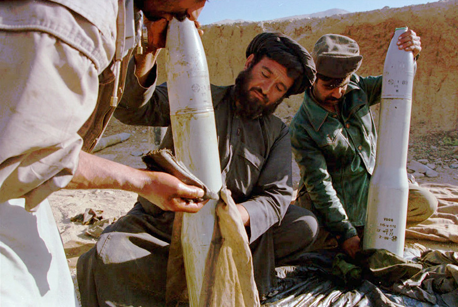 Taliban gunners clean 120mm tank shells Monday, Oct 8, 1996 before firing on enemy positions in the Panjshir valley. The Taliban continues to pursue the ex-government army following its capture of the Afghanistan capital, Kabul.(A P Photo/ John Moore)