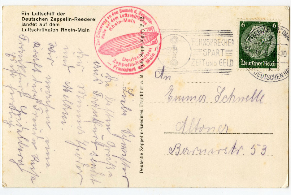 Оборотная сторона немецкой открытки 1939 года и гашением Deutsche Zeppelin Reederei и рекламой новых телефонов («Время и деньги»)