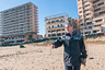 FAMAGUSTA, CYPRUS - JANUARY 05: An exiled resident visits the beach after 43 years in front of abandoned hotels Varosha quarter on January 5, 2017 in Famagusta, Cyprus. Prior to the Turkish invasion of Cyprus in 1974, the abandoned quarter of Varosha was the modern tourist area of the city, and one of the most important tourist destinations in the world.