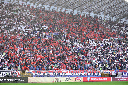 A banner of Croatian fans dedicated to those killed in the Vukovar massacre hits the photo
