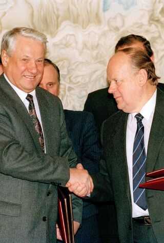 Russian President Boris Yeltsin and Byelorussian leader Stanislav Shushkevich, exchange Slavic Treaty in Brest, USSR (Russian Federation) Dec. 7, 1991.