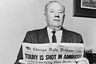 (Original Caption) Reads Of Touhy's Death. Chicago: John "Jake the Barber" Factor reads a newspaper after learning that prohibition-era gangster Roger Touhy had been slain in gangland fashion by shotgun-wielding thurs. Touhy, 61, was paroled last month after serving in prison for kidnapping Factor. Touhy denied the kidnapping ever occurred, claiming he was "framed."
