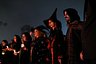 People hold hands during the opening ceremony of the Witches and Wizards Convention, on Friday the 13th at Paranapiacaba village, in Santo Andre, Brazil May 13, 2022.