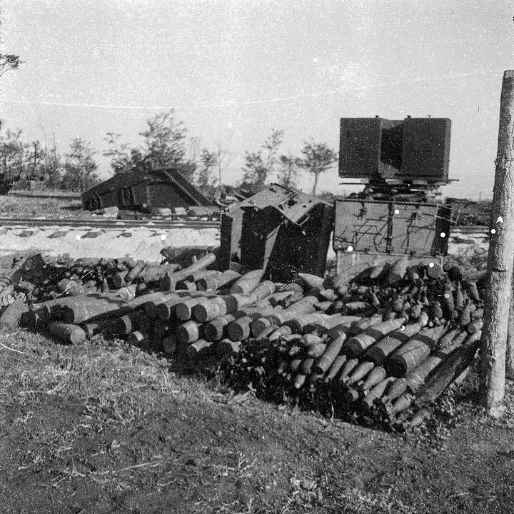Собранные советские снаряды, мины и вагонетки возле железной дороги. Крым. 1941 год
