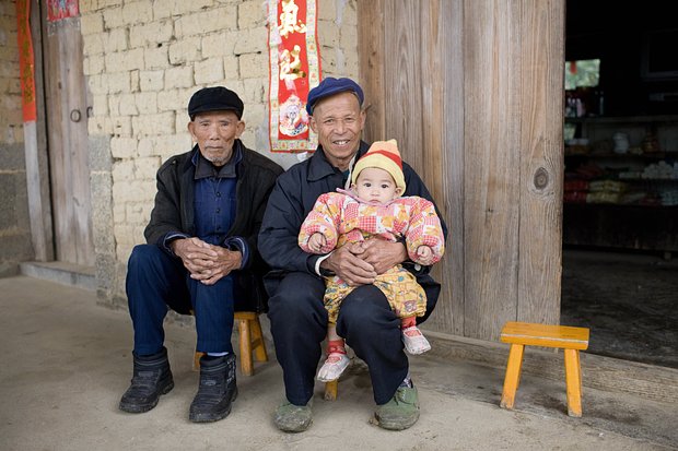 Жители города Фули, городской уезд Синпин, 2008 год. Фото: Tim Graham / Getty Images