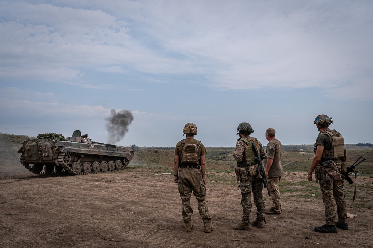 Ukrainian soldiers watch the Ukrainian BMP tank fire at a firing range as Russia-Ukraine war continues in Donetsk Oblast, Ukraine on August 10, 2023. 