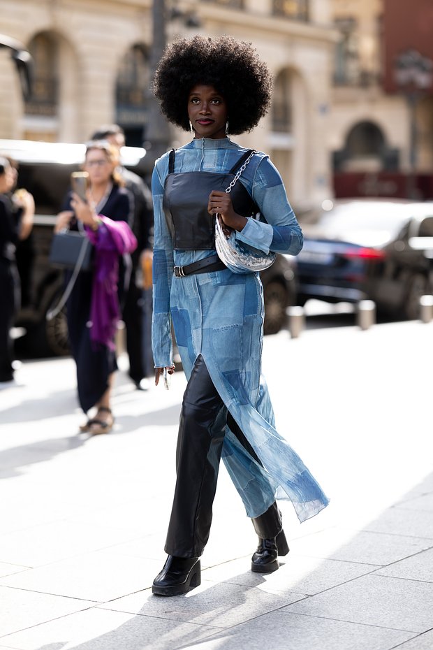 PARIS, FRANCE - SEPTEMBER 29: A guest is seen wearing a black leather tank top over a denim patchwork dress outside Giambattista Valli show during the Womenswear Spring/Summer 2024 as part of Paris Fashion Week on September 29, 2023 in Paris, France. (Photo by Valentina Frugiuele/Getty Images)