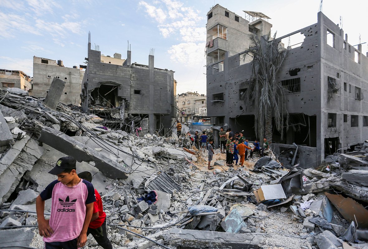 People search through buildings that were destroyed during Israeli air raids in the southern Gaza Strip on October 27, 2023 in Khan Yunis, Gaza. 