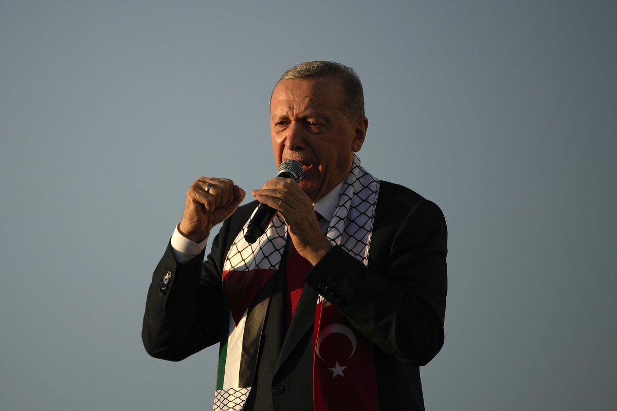 Turkish President Recep Tayyip Erdogan, speaks to the attendees during a rally to show their solidarity with the Palestinians, in Istanbul, Turkey