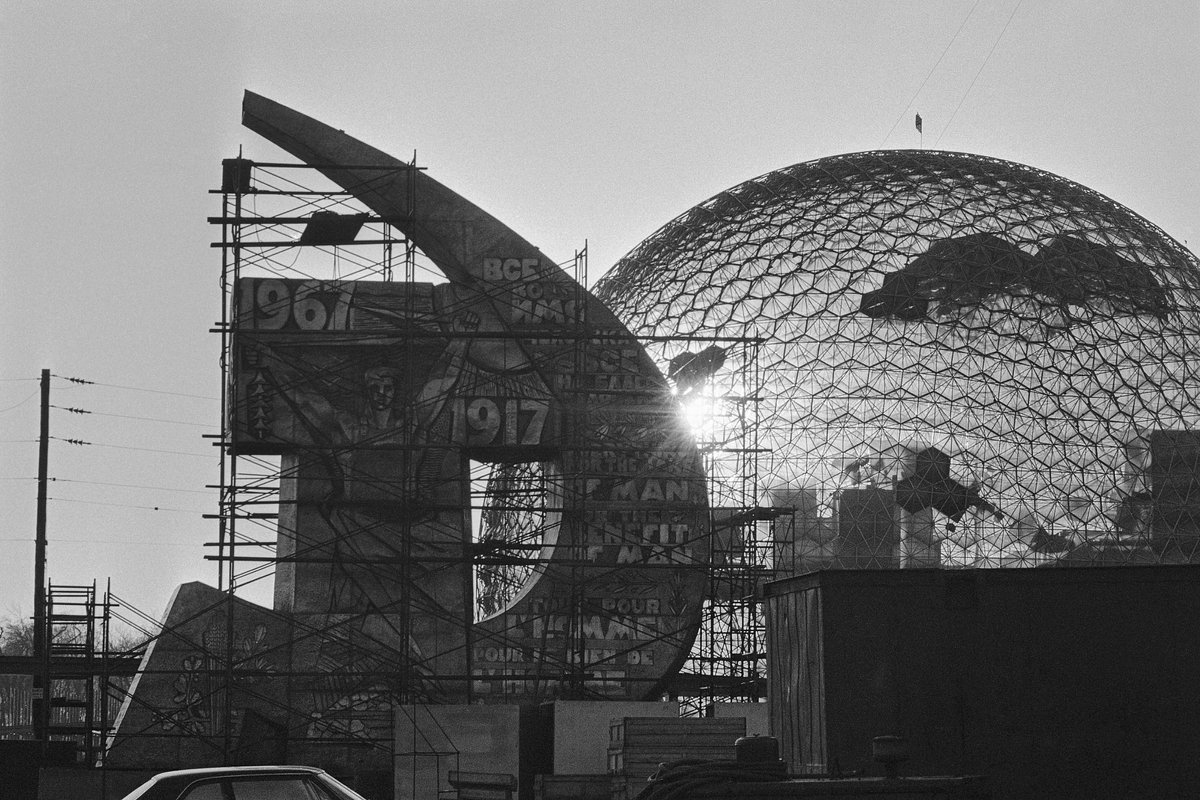  April 17, 1967
The pavilions of the USSR (L) and the United States (R) appear almost ready for the April 28th opening here of Canada's international exposition, Expo 67. The most prominent feature of the Soviet pavilion is the hammer and sickle inscribed with the years 1917 (a reference to the Russian Revolution) and 1967. The U.S. pavilion, located just across a small body of water from the Soviet exhibit, is a 20-story geodesic dome of plastic and glass panels inside a metal skeleton.