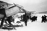 Спасение экипажа парохода "Челюскин", который затонул во льдах в феврале 1934 года. Группа летчика Николая Каманина укрепляет самолет на льдине.
