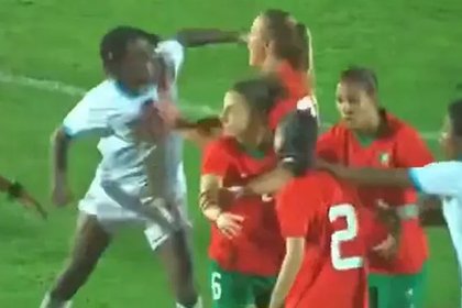 An African football player knocked down her opponent with her fist during a match
