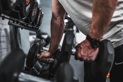Fitness trainer gives advice to men who want to pump up their arms