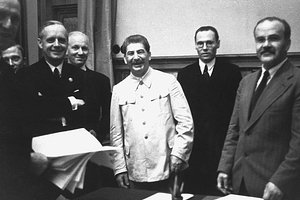 Vyacheslav Molotov (right), foreign minister for the USSR and Joachim von Ribbentrop (left), foreign minister for Germany at the signing of the Soviet-German Non-Aggression Pact with Joseph Stalin (center). Moscow, USSR, August 23, 1939