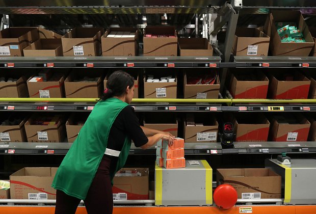 A worker handles cosmetic products at Natura's distribution center in Sao Paulo, Brazil 
