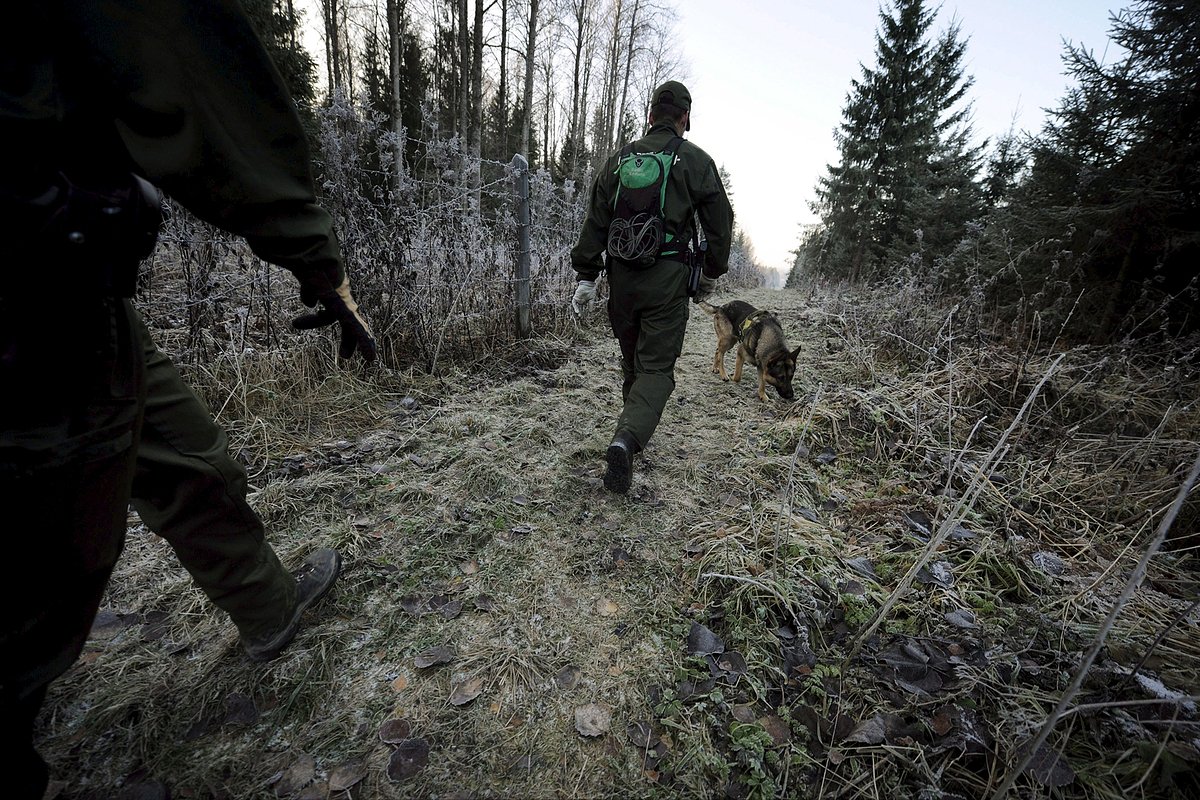 Finnish border guards patrol at the border between Finland and Russia