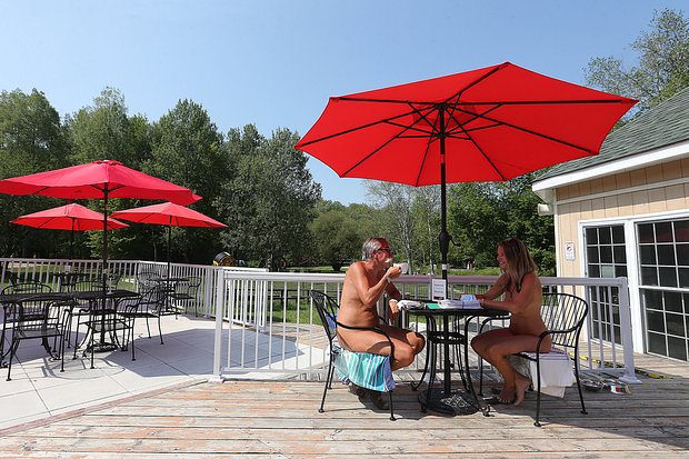 Bare Oaks Family Naturist Park has fully re-opened after several long months of lockdowns and restrictions, though you might see staff and guests wearing one piece of fabric, a facemask.
Sharon, ON- August 6 - Stéphane Deschênes, the owner of Bare Oaks chats with member Leslie Pickett. Bare Oaks Family Naturist Park has fully re-opened after several long months of lockdowns and restrictions, though you might see staff and guests wearing one piece of fabric, a facemask. in Sharon. August 6, 2021. (Steve Russell/Toronto Star via Getty Images)
