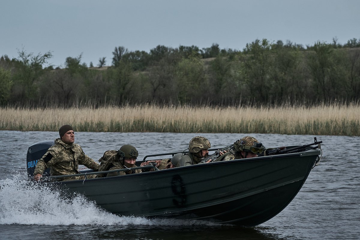 Ukrainian infantrymen from the 126th Territorial Defense Brigade train on boats to carry out combat missions on water, crossing the river and landing