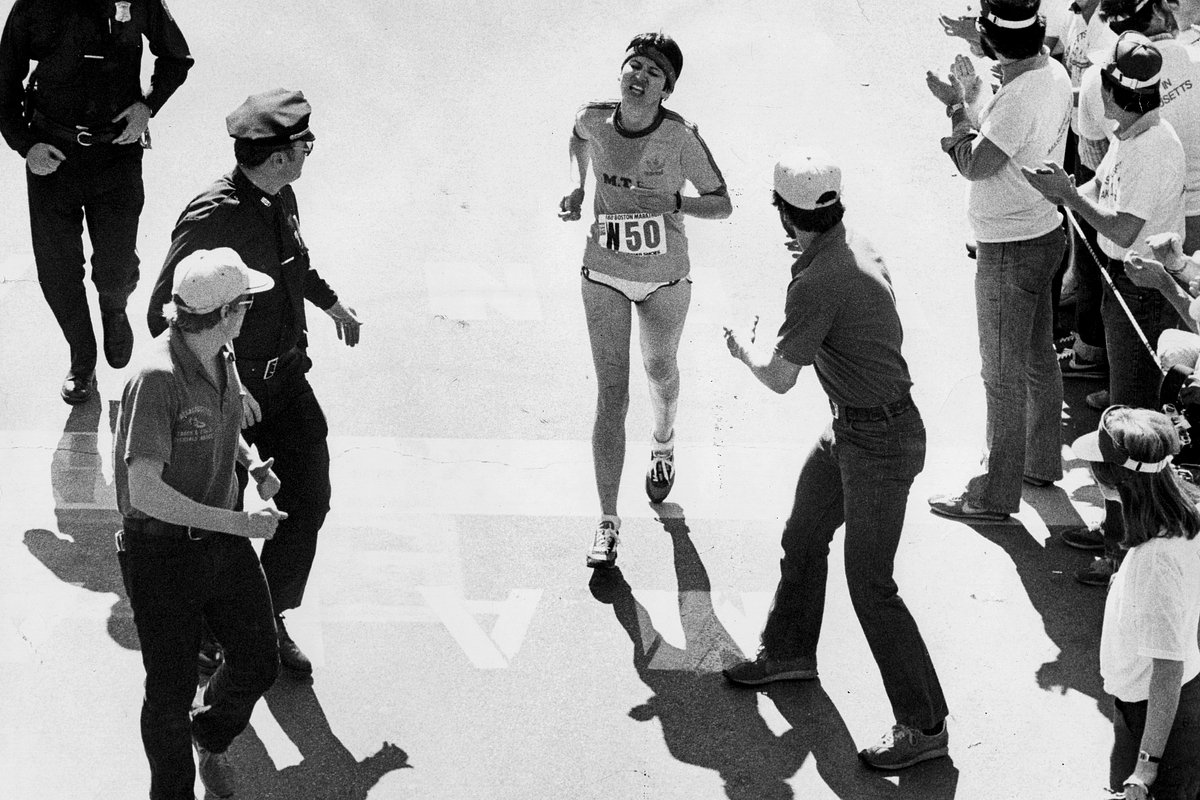 Rosie Ruiz, center, crosses the finish line of the Boston Marathon, winning first place in the female category in Boston on April 21, 1980. Ruiz was later stripped of her medal, after it was discovered that she had cheated
