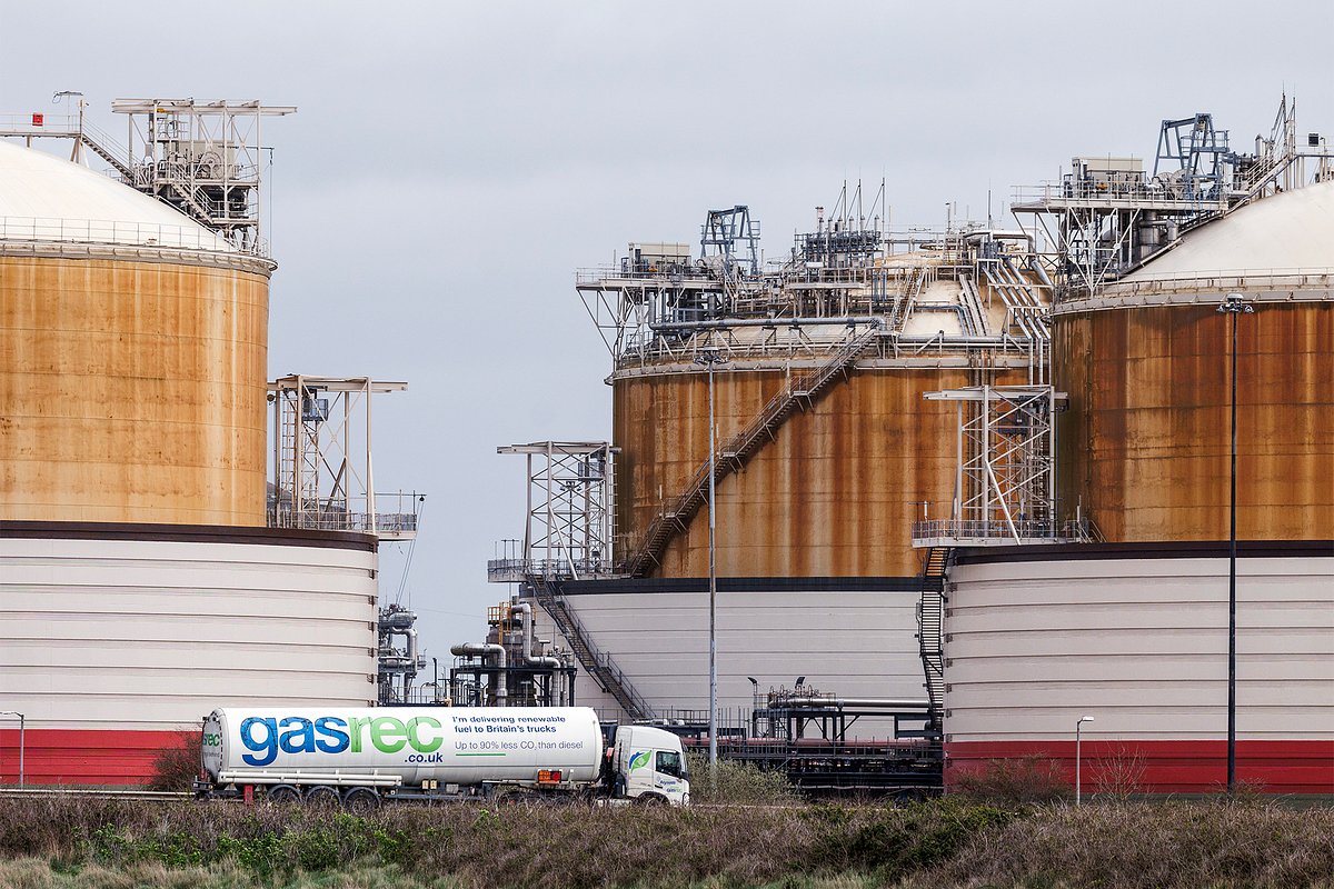 ISLE OF GRAIN, ENGLAND - MARCH 12: A fuel truck drives past Liquefied natural gas (LNG) storage units at Grain LNG importation terminal, operated by National Grid Plc on March 12, 2026 in Isle of Grain, England. The ongoing war in the Middle East has disrupted shipments of Liquefied Natural Gas, forcing several large energy companies to declare 