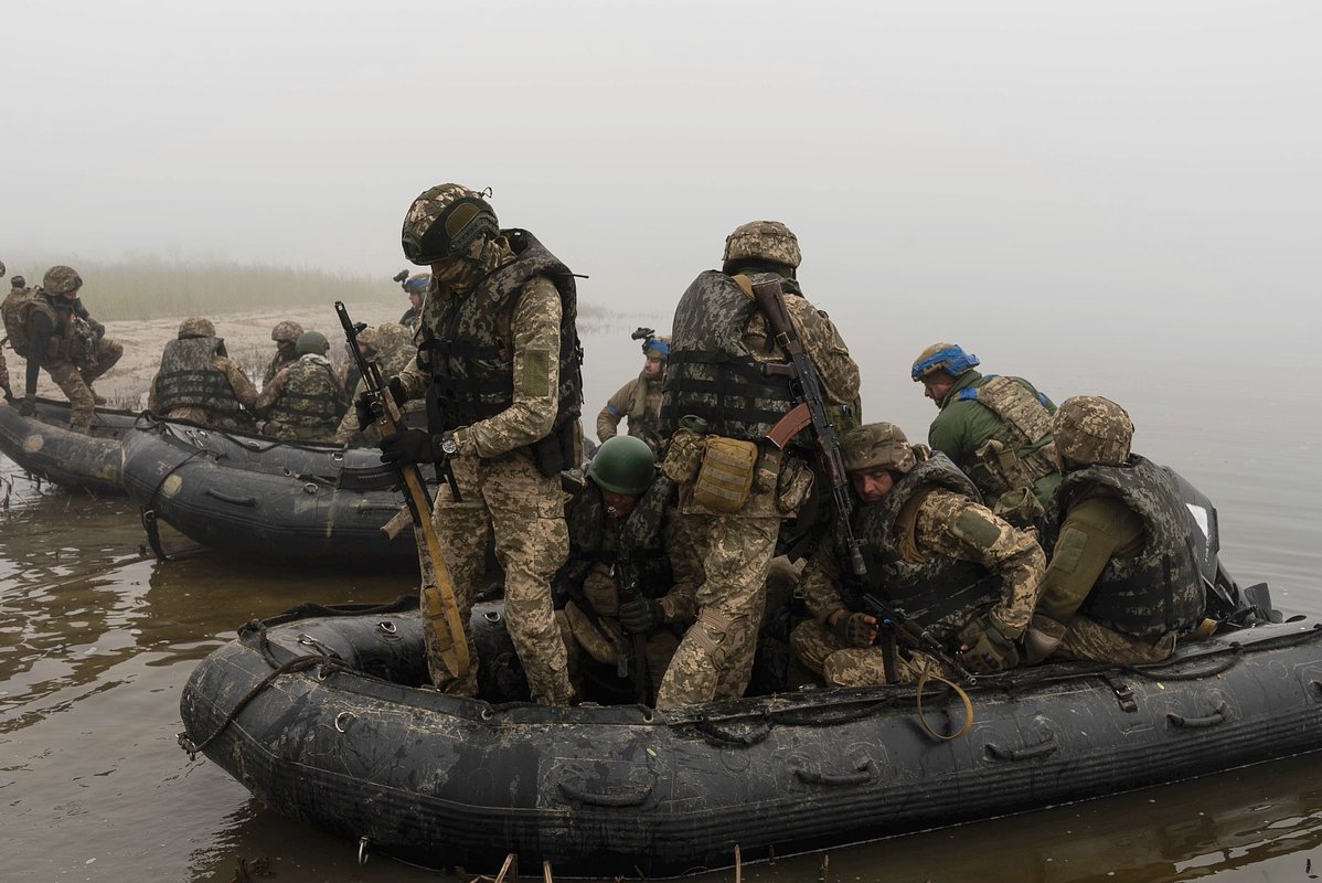 A group of Ukrainian marines sail from the riverbank of Dnipro at the frontline near Kherson