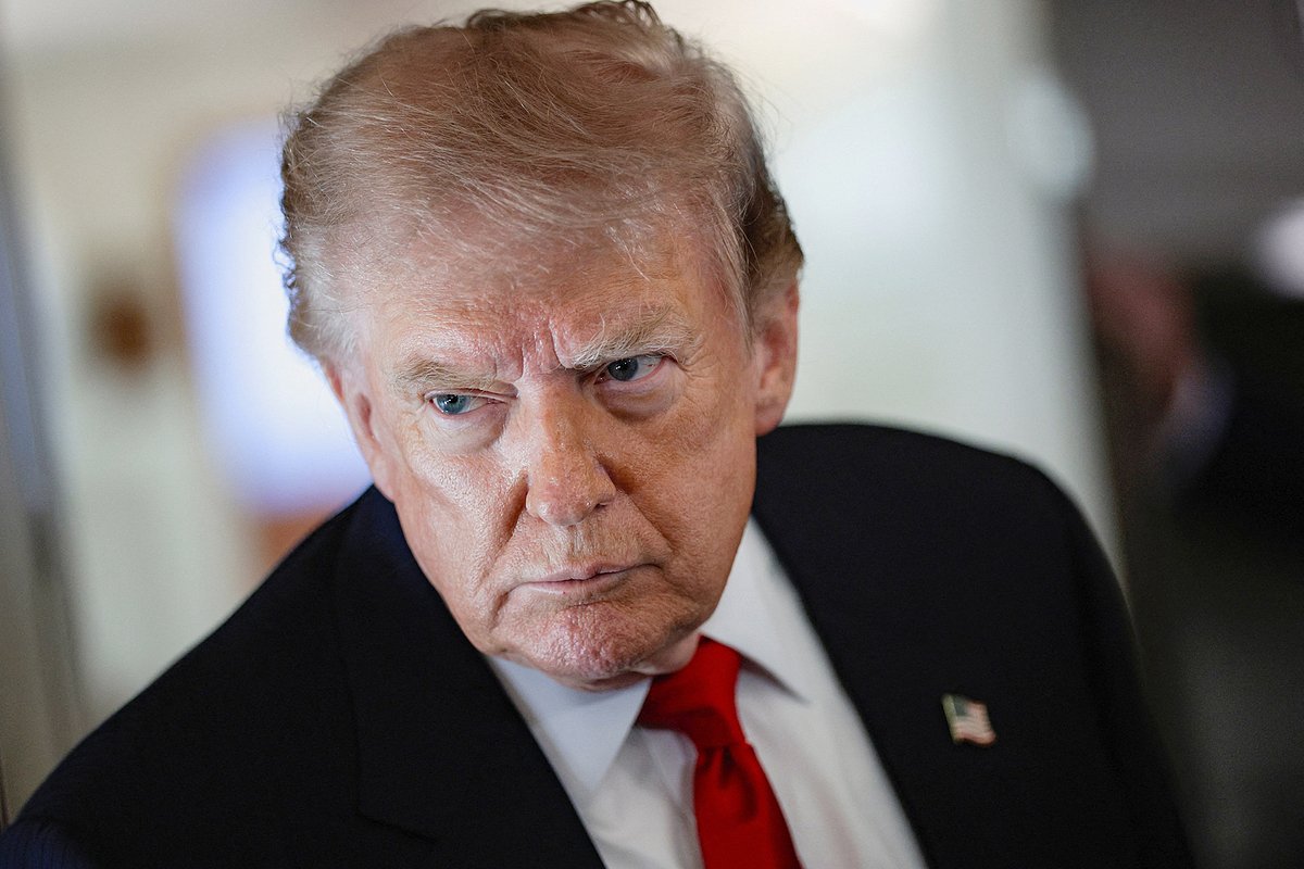 U.S. President Donald Trump speaks to reporters aboard Air Force One en route to Michigan, U.S., July 27, 2026