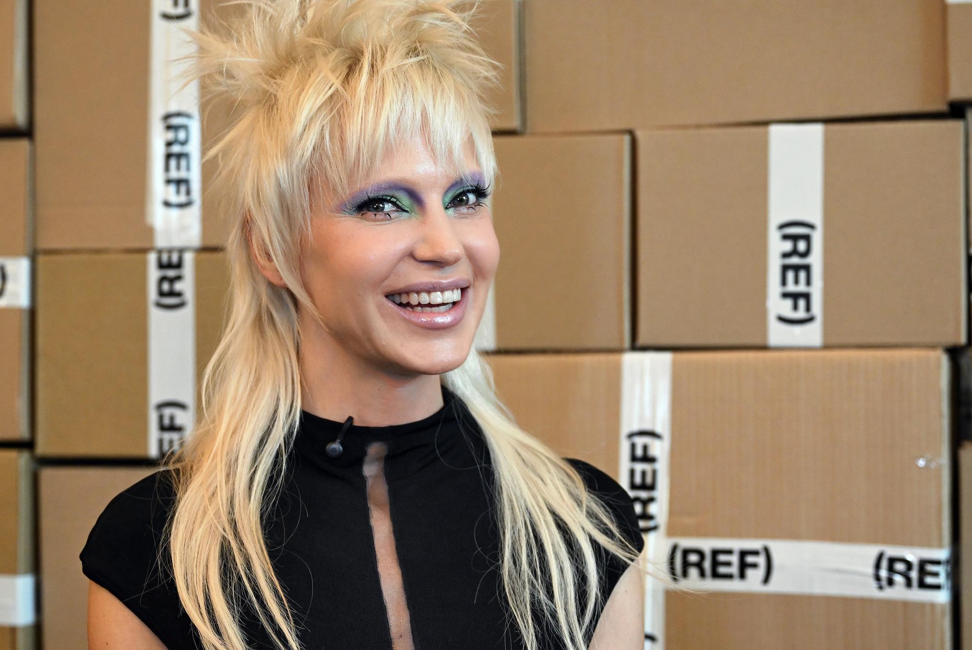 Singer Glukoza Wears Racy Outfit to Moscow Vinyl Shop