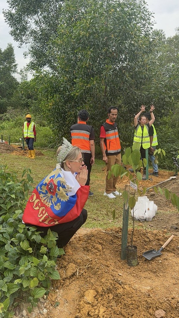 Lyudmila Sekriy and the tree of Russia in Malaysia national park. Personal archive